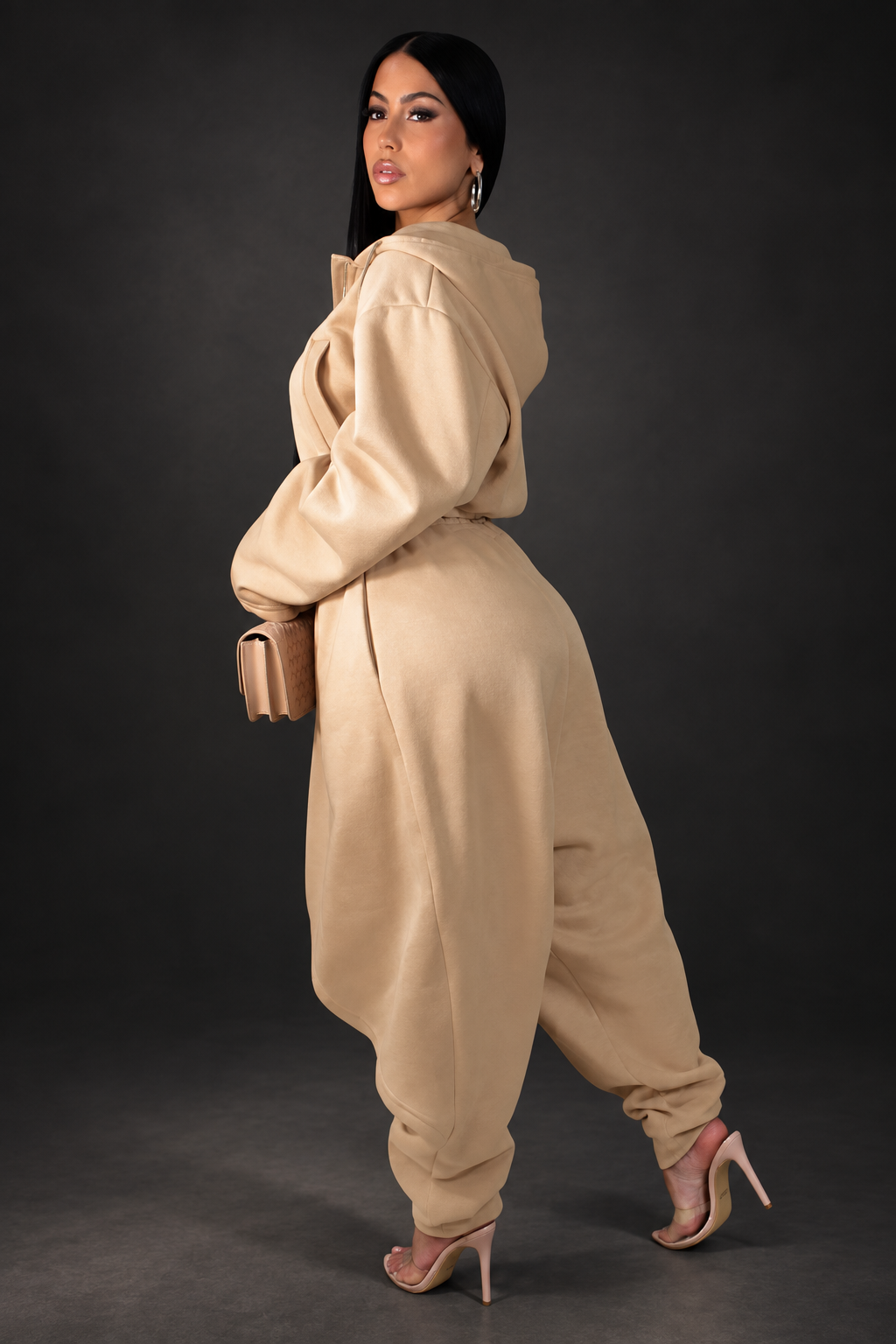Tan pant set side-view photo on a dark studio background